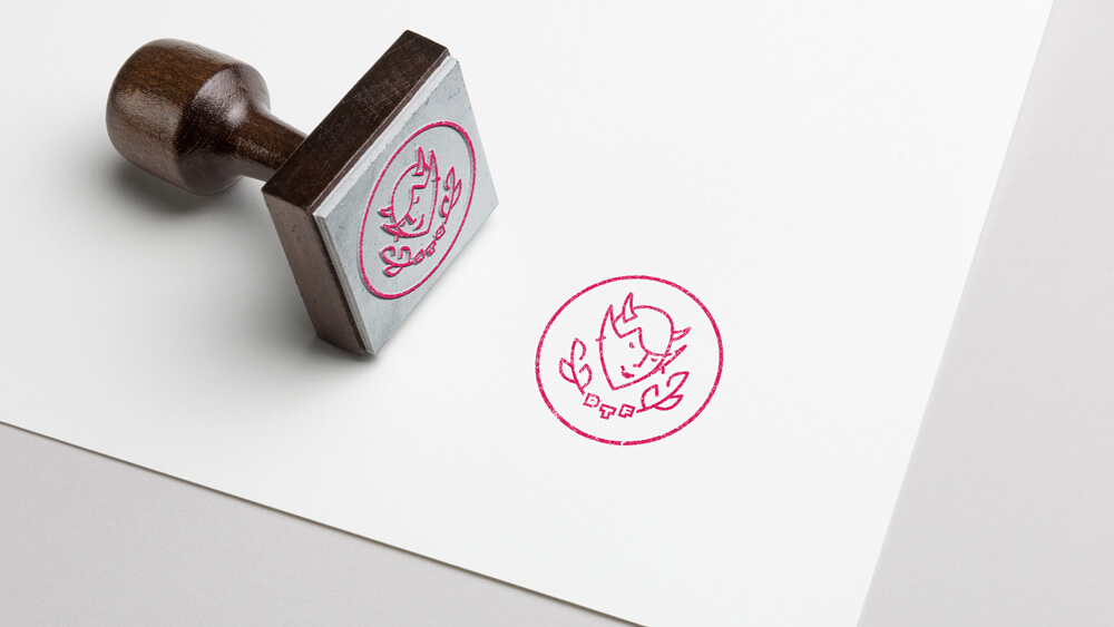 The badge version of the Devil Tree Films logo on a rubber stamp.